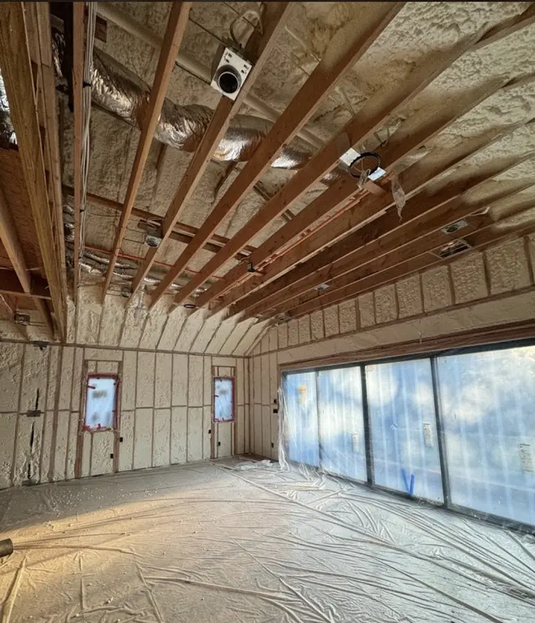 Interior walls and ceiling insulated with spray foam during new construction in Panthersville